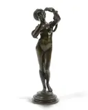 A patinated bronze of a nude female snake charmer by Josef Wind, bronze, sold Nov 2025