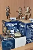 comprising Cuddy DW106, Teach (Mr Ronald Saveloy) DW118, by Five Boxed Clarecraft Discworld Sculptures, sculpture, sold Mar 2025