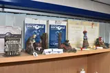 comprising a pair of Clarecraft Draco Nobilis bookends DW109 and by Five Boxed Discworld Sculptures, sculpture, sold Mar 2025