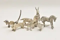 to include a hare, two phesants, a horse, three dashunds by Assorted White Metal Figurines, sculpture, sold Feb 2025