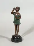 La petite siffleuse by Suzanne Bizard, Bronze patiné, sur un socle en marbre noir, sold Mar 2026