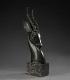 Tête d'antilope by Georges Raoul Garreau, Épreuve en bronze patiné vert antique et brun nuancé sur socle cubique en marbre veiné gri, sold Nov 2025
