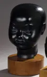 Buste d'enfant asiatique by Riccardo Scarpa, Bronze à patine brune signé au dos, sur socle en bois, sold Oct 2019