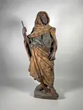 Le gardien du harem by Friedrich Goldscheider, Epreuve en terre cuite polychromée (petites égrenures, restauration à un pouce), le fusil, sold Apr 2024