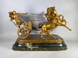 Aurige romain by Angiolo Vannetti, Epreuve en bronze à patine dorée, sold Feb 2024