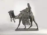 Méhariste touareg by Leonardo Bazzaro, Epreuve en bronze à patine brun foncé, sold Oct 2023