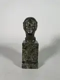 Tête de jeune femme by Paul Silvestre, Epreuve en bronze à patine vert nuancé, sold May 2023