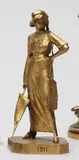 Parisienne tenant un parapluie by Henri Varenne, 1911, Épreuve en bronze, fonte d’édition à patine dorée de Susse Frères fondeur, marque de fonde, sold Nov 2017