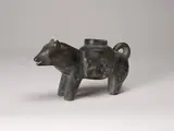 Dog Carrying a Pack by Mary Yuusipik Singaqti, stone sculpture, sold Feb 2025