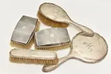 to include a matching hair brush, hand held mirror, and a clothes brush, by Five Silver Vanity Items, sculpture, sold Aug 2024