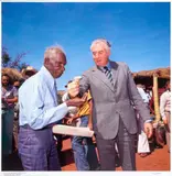 Prime Minister Gough Whitlam pours soil into the hands of traditional landowner, Vincent Lingiari by Mervyn Bishop, 1975, digital inkjet print, offered Sep 2026