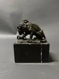 Lion et serpent by Louis-Albert Carvin, Bronze à patine brune sur une base en marbre, sold Nov 2023