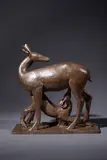 Biche allaitant son faon by Paul Simon, Epreuve en bronze à patine rouge Sur la terrasse, sold Oct 2025