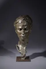 Tête de jeune femme by Christophe Charbonnel, Epreuve en bronze à patine verte nuancée, sold Oct 2025