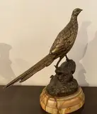 Faisan sur un tertre rocheux by Leon Bureau, Épreuve en bronze à patine brune, sold Jan 2024