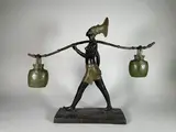 Femme Mangbetu by René Rozet, Epreuve en bronze à double patine noir et vert nuancé, sold Apr 2023
