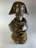 Buste de Napoléon by Renzo Colombo, Epreuve en bronze à patine brun nuancé, rehaussée d'or sur l'aigle, sold Dec 2022