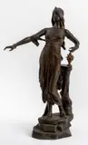 Salome" patinated bronze sculpture depicting the female figure standing atop a rocky base and wearing a diadem by Edouard Drouot, bronze earring, sold Jul 2023