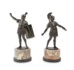 One holding a by Gotthilf Jaeger, bronze, sold Mar 2025