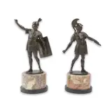 One holding a by Gotthilf Jaeger, bronze, sold Mar 2025