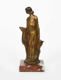 Diana with a Deer patinated bronze on a red marble base by Zoltan Kovats, bronze, offered Oct 2023
