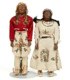 NATIVE AMERICAN HAND-CARVED WOODEN DOLLS, LOT OF TWO by Goingback Chiltosky, carved wooden heads with lightly painted facial features, sold Mar 2026