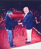 Victor Lingiari, Son Of Vincent Lingiari, Pours Soil In The Hand Of The Former Prime Minister Gough Whitlam At Yeperreny by Mervyn Bishop, 2001, type C photograph, offered Dec 2020