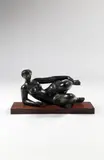 Sandrine ou Nu allongé, les jambes pliées, le bras droit posé by Antoniucci Voltigera Volti, Bronze à patine noire et reflets verts, sold Dec 2014