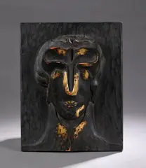 Sans titre by Pierre Dedieu, 1959, Panneau au visage doré Fort bas-relief en bois sculpté et partiellement patiné à l'or, sold Oct 2025