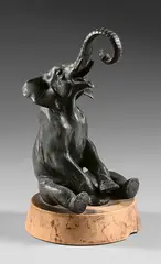 Eléphant assis trompe levée by Charles Paillet, Bronze à patine verte signé en creux et reposant sur un socle en marbre, sold Jun 2024