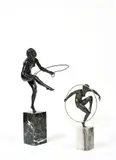 Jeune femme au cerceau, bronze à patine verte sur socle en onyx by Marcel Bouraine, Bronze à patine noire sur socle marbre vert, trace de signature, sold Apr 2022