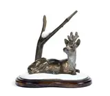 Chevreuil couché dans la neige by Dany Coutinsouzas, Bronze à double patines, sold Feb 2022