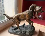 Épagneul tenant un faisan dans sa gueule by Émile Lienard, Épreuve en bronze à double patine, sold Jul 2025