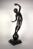 Jeune garçon sur une boule by Johannes Götz, Epreuve en bronze à patine brun noir nuancée, sold Dec 2021