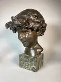 Portrait d'enfant by Paul Landowski, 1894, Epreuve en bronze à patine brun nuancé, sold May 2018