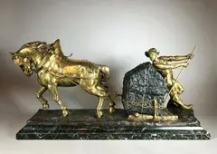 Le carrier by Edouard Drouot, Epreuve en bronze à double patine et granit, sold Jun 2021