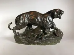 Tigre terrassant une gazelle by Antoine-Louis Barye, Epreuve en bronze à patine brun nuancé, sold Jun 2021
