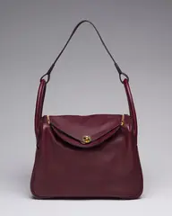 A ROUGE H CLÉMENCE LEATHER LINDY 30 WITH PALLADIUM HARDWARE by Hermès, A ROUGE H CLÉMENCE LEATHER LINDY 30 WITH PALLADIUM HARDWARE, sold Dec 2024