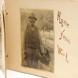 In Dixieland Photobook by Bayard Wootten, A compilation of vintage photographs bound with string and titled to each page, sold Mar 2026