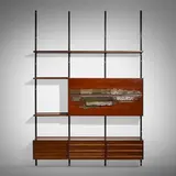 Sistema E22 shelving by Osvaldo Borsani and Arnaldo Pomodoro, 1957, walnut, enameled steel and aluminum, copper, glass, sold Mar 2023