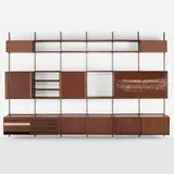 Sistema E22 shelving by Osvaldo Borsani and Arnaldo Pomodoro, 1957, walnut, mahogany, patinated metal, copper, linen, glass, sold Mar 2023