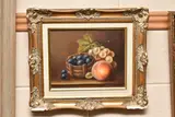A still life study of grapes and a peach by John F. Smith, oil on canvas, sold Aug 2023