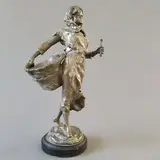 Jeune femme au panier de vannerie by Alfred Grévin, Bronze argenté, monté sur une base moulurée en marbre noir, sold May 2025