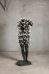 dit ARMAN Diego STRAZZER éditeur La bien vêtue II by Arman, 2004, Epreuve en bronze à patine brun - vert et accumulation de porte-manteaux, sold Mar 2025