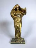 La Nature se dévoilant à la Science by Louis-Ernest Barrias, Epreuve en bronze à triple patine brun-clair, vert foncé et vieil or, sold Feb 2021