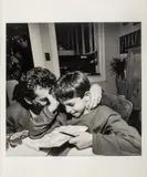 Tom and Giancarlo," 1999 by Lee Friedlander, gelatin silver print photograph of a man and boy indoors, sold Aug 2023