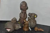 to include 'Mickey Mouse' a lamb, clown, laughing duck, together with a by Six Bronzed Metal Figures, sculpture, sold Jul 2023