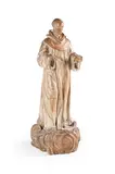 A large carved lime wood figure of a monk, dated 1833 by T Huidiez, 1833, sculpture, sold Nov 2024