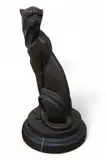 A stylised bronze model of a seated cheetah by Miguel Fernando Lopez, bronze, sold Jan 2025