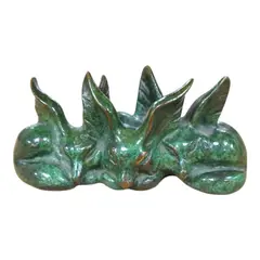 A green patinated bronze group of three seated foxes by Raoh Schorr, bronze, sold Dec 2024